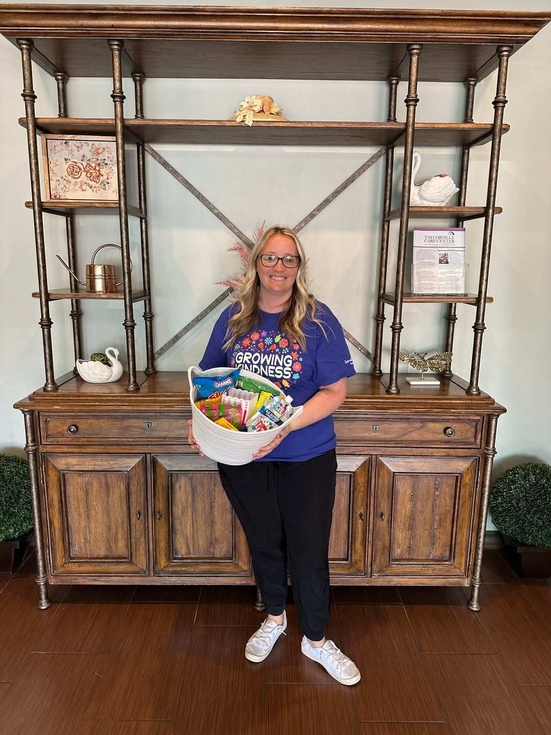 care person holding basket of goodies